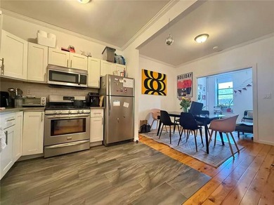 Well-maintained 3-family property featuring a one-store - photo 8