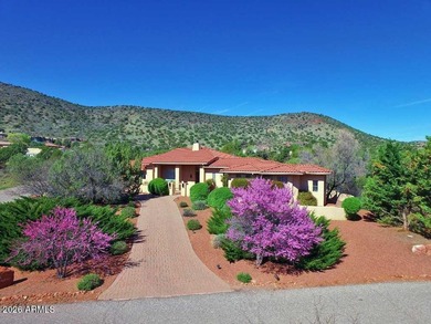 This custom-built residence at 144 Sun Up Ranch Rd is a