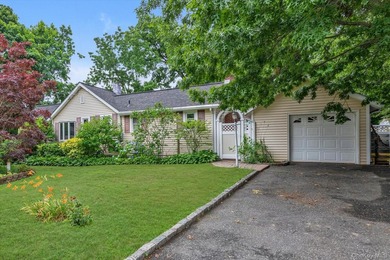 Discover Your Dream Home in Amityville!  Step into this stunning - photo 1