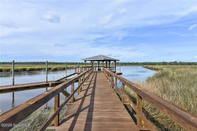 Nice pond front lot in River Place Plantation. Walk to the - photo 4
