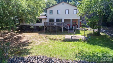 Welcome to this 4-bedroom, 3-bathroom waterfront retreat on the - photo 44