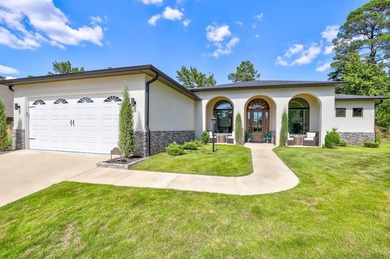 Welcome to this stunning stone and stucco Mediterranean-style