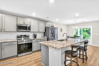 Welcome to 10050 Woodland Cove, a practically brand new home - photo 6