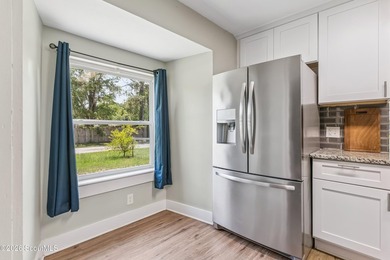 Discover this beautifully updated 3 bedroom, 2 bathroom home - photo 8