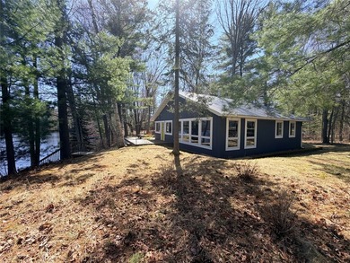 Nestled among mature pines and hardwoods, this adorable cabin - photo 4
