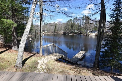 Nestled among mature pines and hardwoods, this adorable cabin - photo 7
