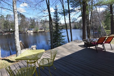 Nestled among mature pines and hardwoods, this adorable cabin - photo 8