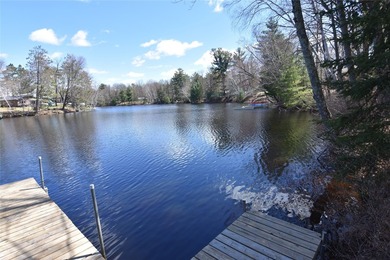 Nestled among mature pines and hardwoods, this adorable cabin - photo 9