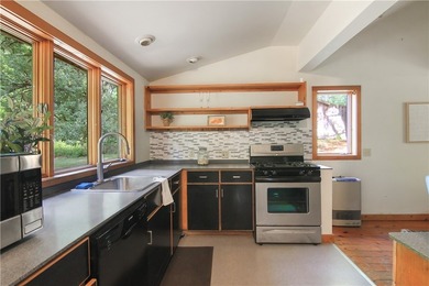 Beautiful contemporary home tucked into the woods with a creek - photo 7