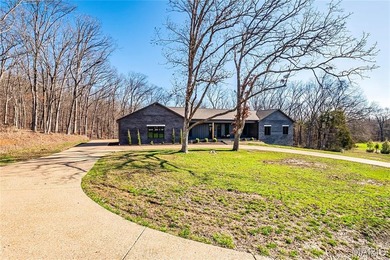 Stunning custom-built ranch home situated on 4.8 acres, just