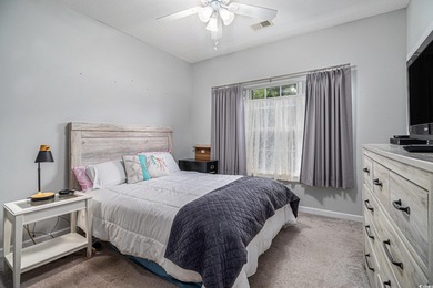 Enjoy effortless coastal living in this first floor, end-unit