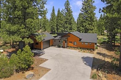 Modern mountain living meets golf course serenity in this - photo 1
