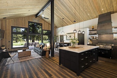 Modern mountain living meets golf course serenity in this - photo 7
