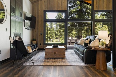 Modern mountain living meets golf course serenity in this - photo 8