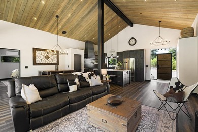 Modern mountain living meets golf course serenity in this - photo 10
