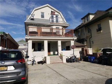 Welcome to a fully detached three-family residence nestled in - photo 1