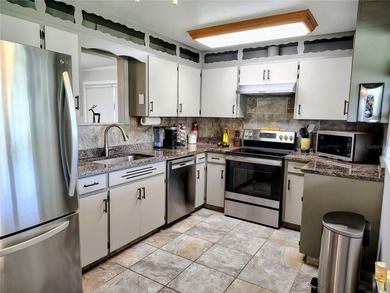 Waterfront -- Situated on an oversized corner canal lot with - photo 17