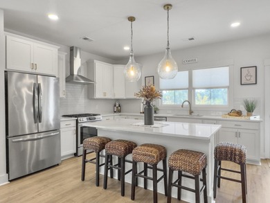 Welcome to 139 Sabal Court, a truly exceptional townhome in