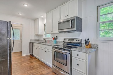 This beautifully renovated brick ranch awaits its new owners in - photo 13
