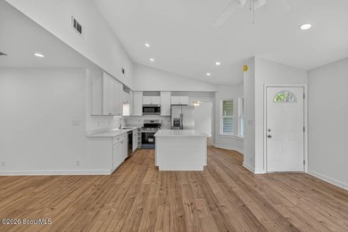 LIKE NEW and completely renovated from top to bottom, this - photo 4