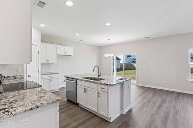 The Magnolia plan by Smith Family Homes is under construction in - photo 4