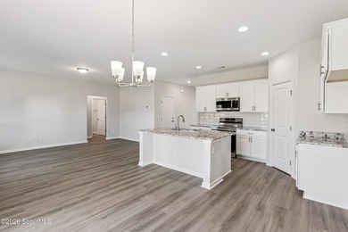 The Magnolia plan by Smith Family Homes is under construction in - photo 7