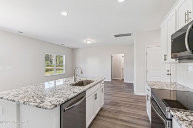 The Magnolia plan by Smith Family Homes is under construction in - photo 8