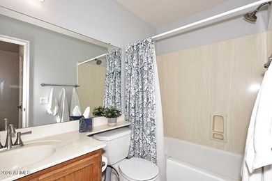 Ideal interior location with south facing patios on the big - photo 14