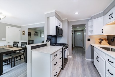 Welcome home to this beautifully updated split-level in the - photo 3