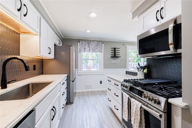 Welcome home to this beautifully updated split-level in the - photo 6