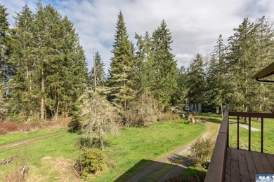 Nestled on 5 private acres in Sequim, this stunning 3 - photo 4