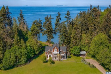 From the water's edge to the summit above, this rare 10-acre - photo 1