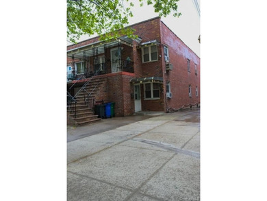 Welcome to this well-maintained two-family brick home located in - photo 2