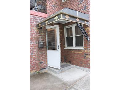 Welcome to this well-maintained two-family brick home located in - photo 3