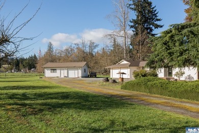 Set on 1.3 acres with beautiful mountain views, this property - photo 1