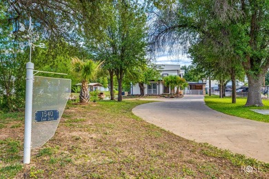 Stunning Lake Nasworthy home nestled along two canals with main - photo 3