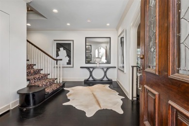 This beautifully reimagined Tudor home, freshly painted and