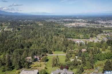 Prime one-acre lot in Sequim with stunning water views - photo 10