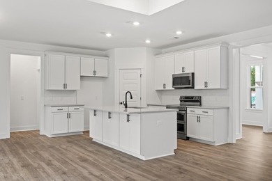 The Fischer plan offers easy main-level living with Lowcountry - photo 3