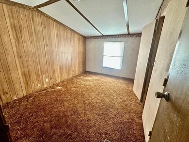 Situated on approximately 0.9 acres, this 1985 18x80 single-wide - photo 15