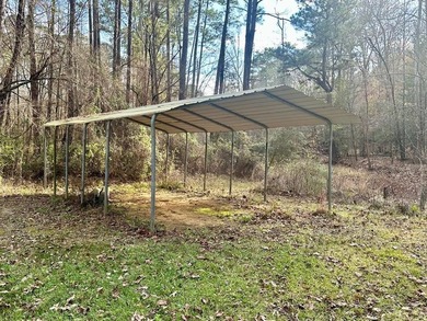 Situated on approximately 0.9 acres, this 1985 18x80 single-wide - photo 17