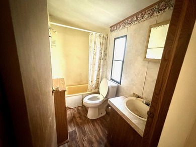 Situated on approximately 0.9 acres, this 1985 18x80 single-wide - photo 19