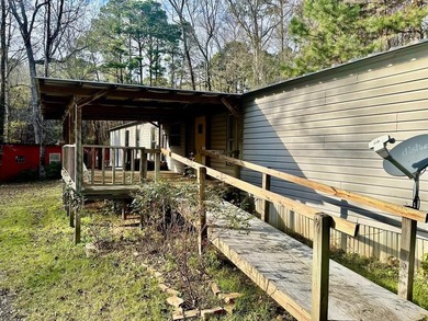 Situated on approximately 0.9 acres, this 1985 18x80 single-wide - photo 20
