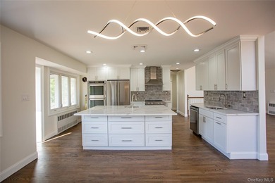 Welcome to this masterfully renovated High Ranch, offering the - photo 3