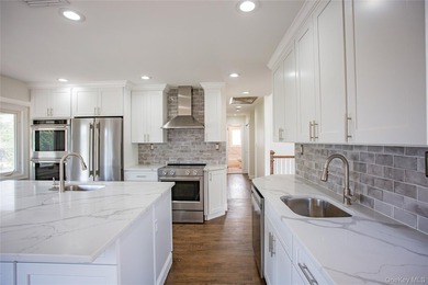 Welcome to this masterfully renovated High Ranch, offering the - photo 8