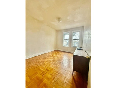 Spacious and bright apartment featuring hardwood floors and high - photo 2