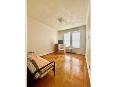 Spacious and bright apartment featuring hardwood floors and high - photo 3