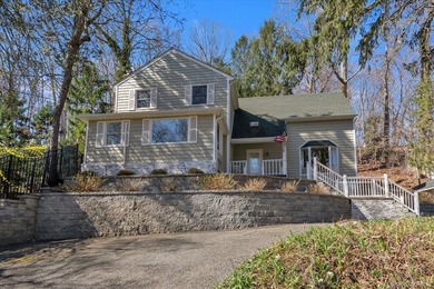 Nestled on a private and picturesque .88-acre property, this - photo 1