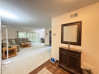 Welcome to this beautifully maintained second-floor condo in the - photo 2
