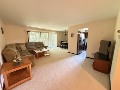 Welcome to this beautifully maintained second-floor condo in the - photo 3